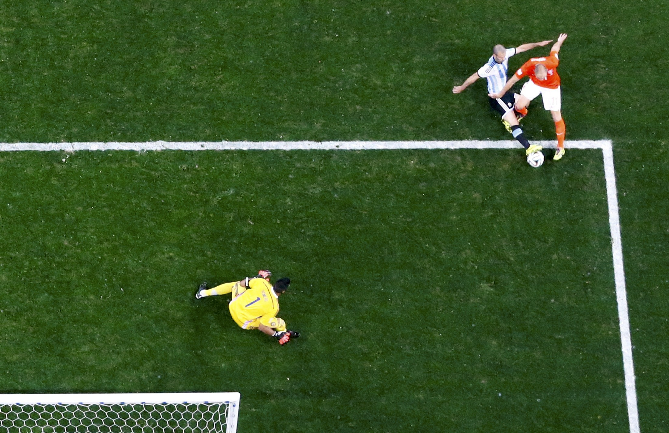 Argentina's Javier Mascherano deflects a shot by Arjen Robben of the Netherlands during their 2014 World Cup semi-finals at the Corinthians arena